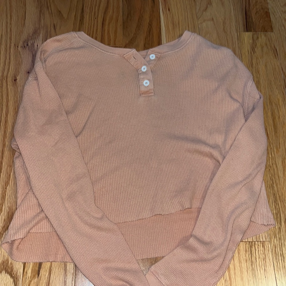 Pink cropped top.